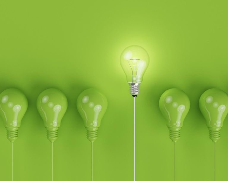 green light bulbs on green background