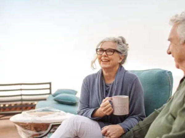 Couple drinking coffee outside in one of the best places to retire, Gig Harbor.