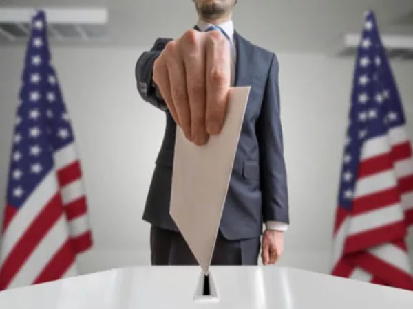 Person casting a vote after moving and changing voter registration.