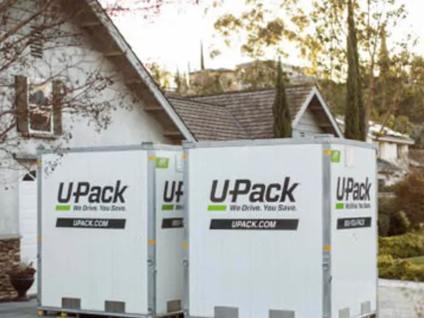U-Pack ReloCubes, which are often compared to PODS containers, sitting in a driveway.