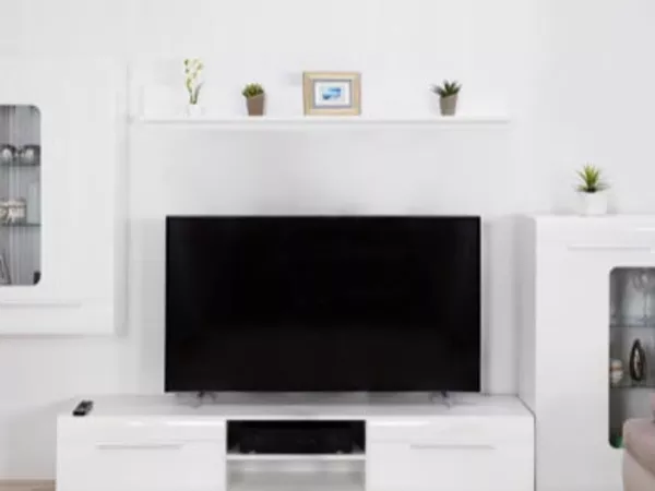 Large screen TV in a living room, waiting to be packed before a move.