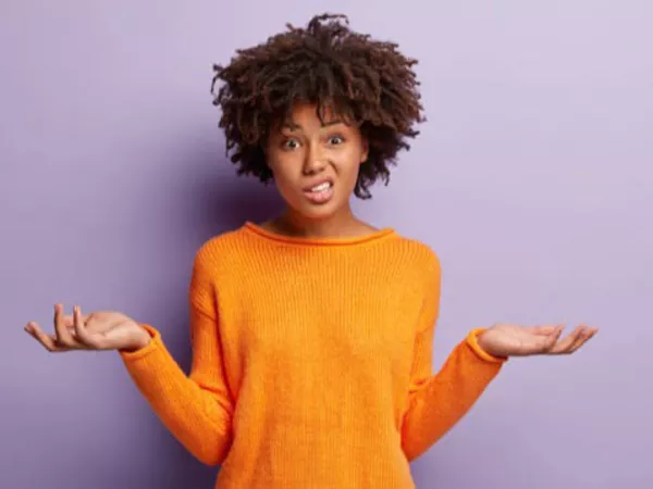 Woman shrugging her shoulders wondering how to move without a forwarding address.