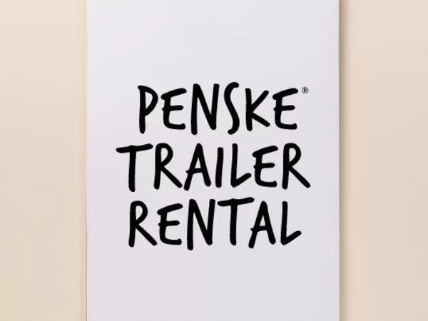 Notepad with text reading &quot;Penske Trailer Rental&quot;
