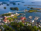 Aerial view of Alaskan town on the water, showing buildings and stores.