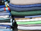 Stack of moving blankets folded and ready to use for wrapping furniture