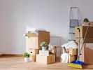 Packing household items after finding the cheapest way to move out of state.