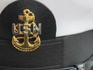 U.S. Navy hat, waiting to be packed for a move.