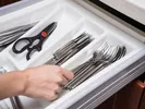 Packing up silverware for a move.
