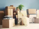 Stacks of boxes, furniture and other furnishings as person moves from an apartment.