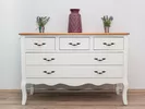 White dresser sitting in a house before a move