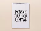 Notepad with text reading "Penske Trailer Rental"