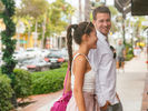 A couple enjoys shopping in a walkable district in Naples.