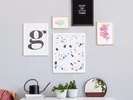 An inexpensive artwork gallery to decorate a living room wall.