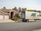 A U-Pack trailer parked on a street, ready for an out-of-state move.