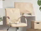 n office chair and computer monitor wrapped in paper padding for a move.
