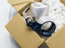 packing box with tape gun
